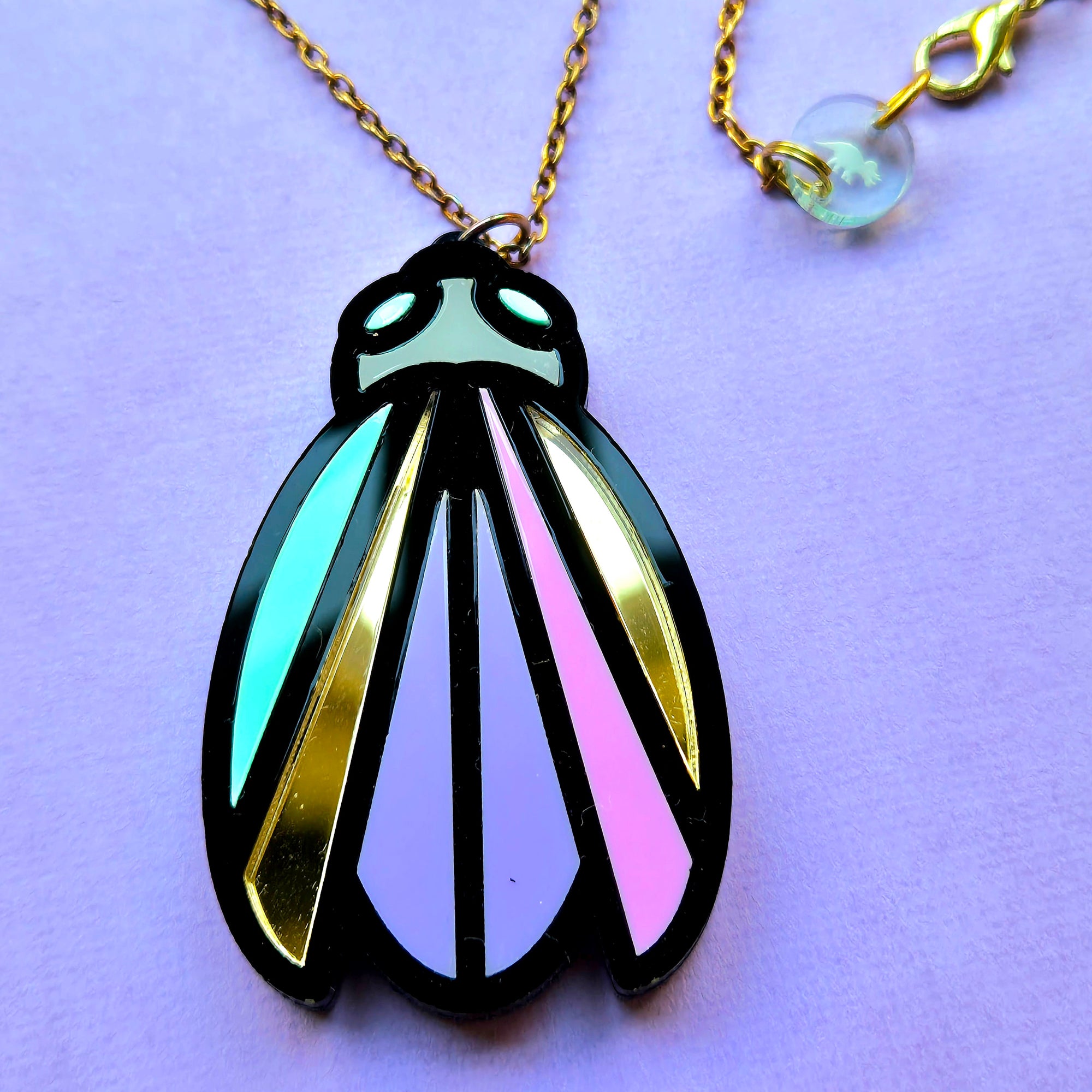 Lined Bug Pendant Necklace by Designosaur