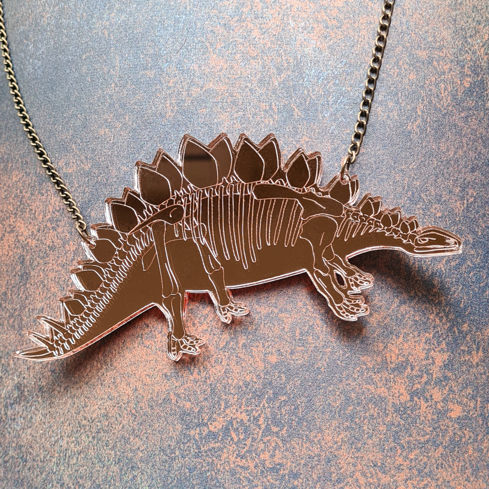 Stegosaurus Skeleton Necklace  (Rose Gold) by Designosaur